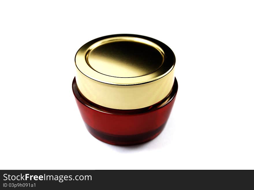 Red cosmetics bottle in the white background