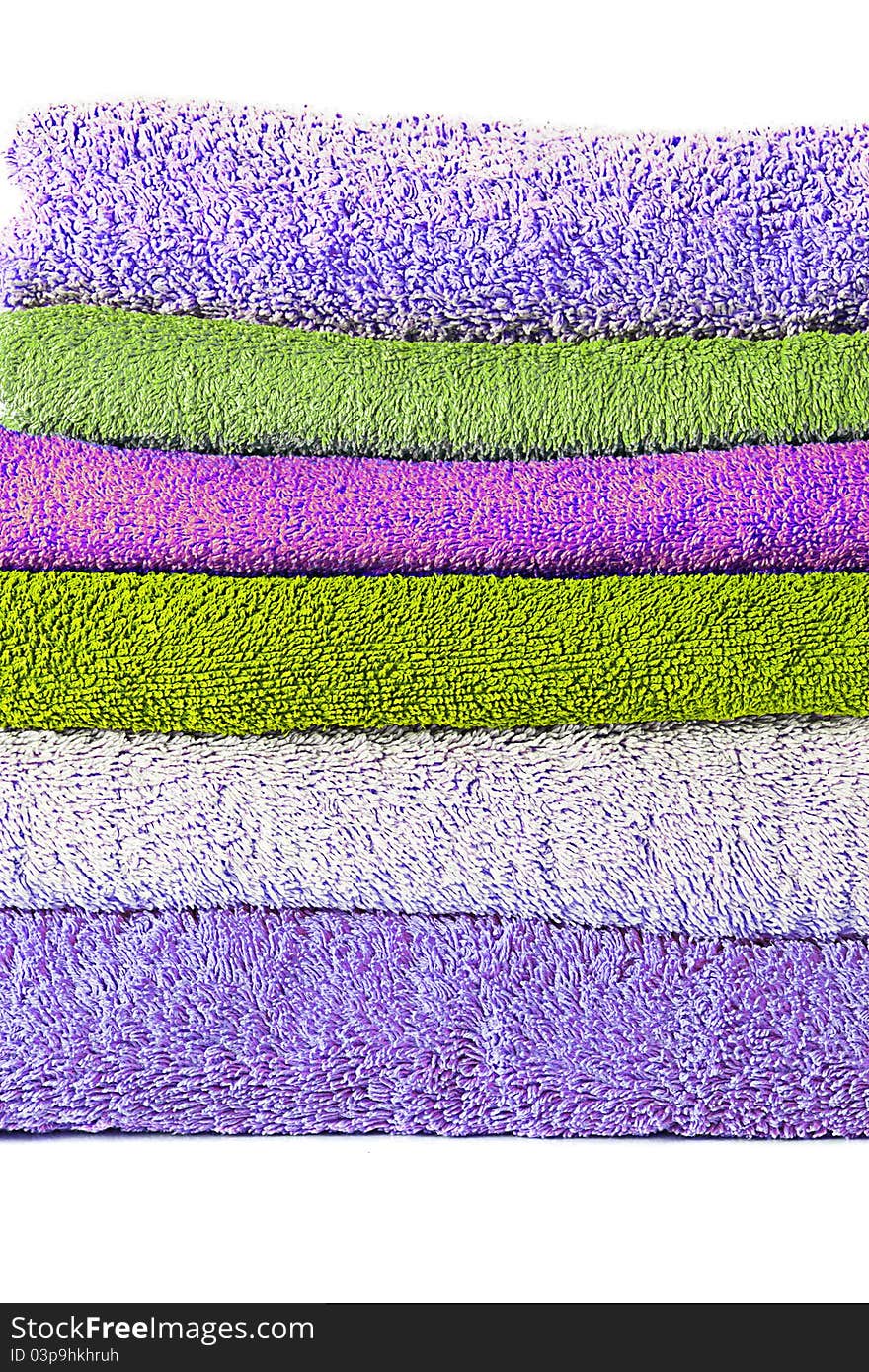 Different shades of towels stacked on each other