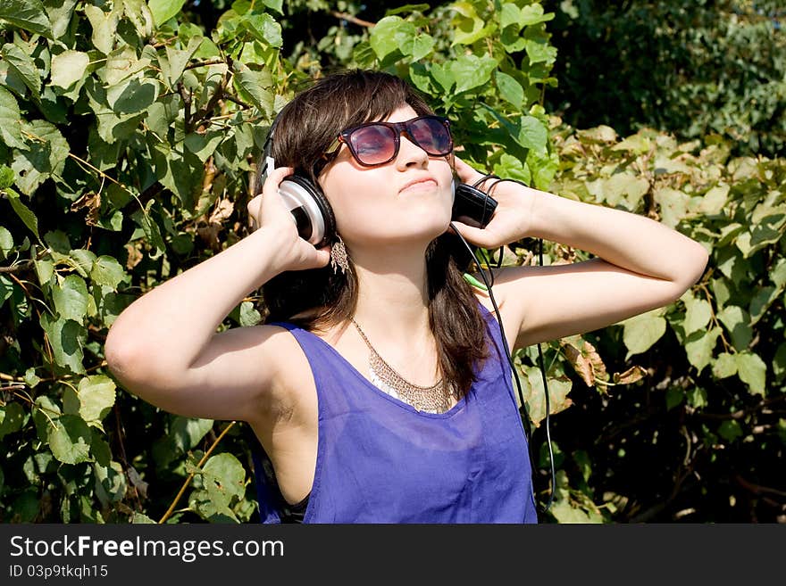 Girl listening music in headphones. Girl listening music in headphones