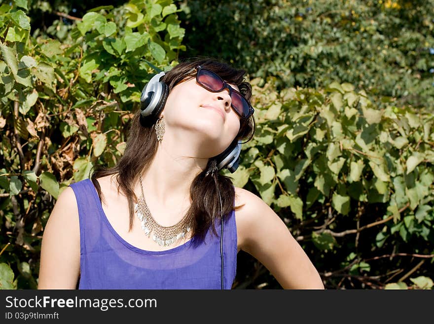 Girl listening music in headphones