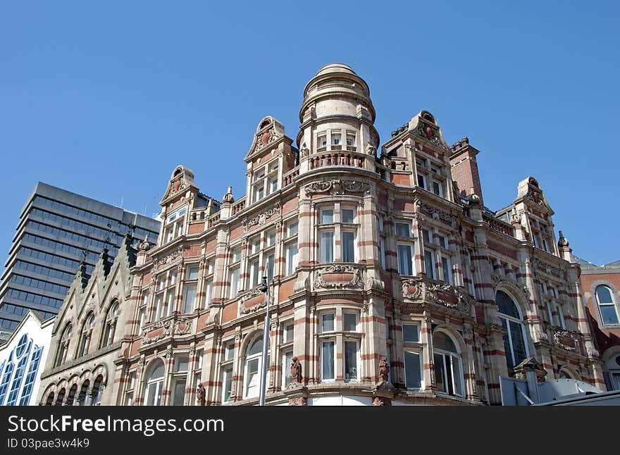 A Vintage Corner site Red and Cream Office Building in an English City. A Vintage Corner site Red and Cream Office Building in an English City