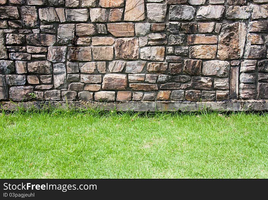 Rock background with a grass