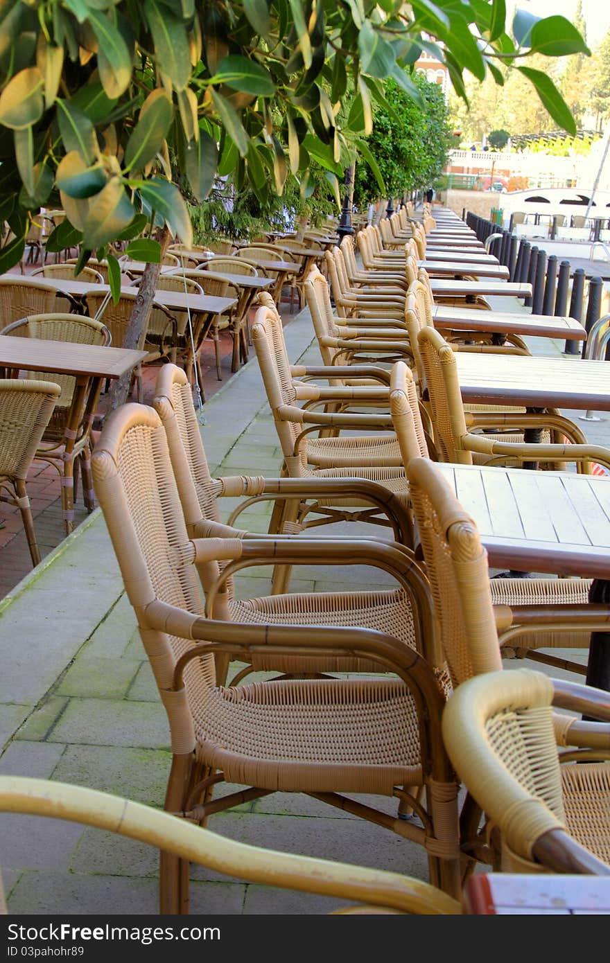 Image of street cafe with wicker chairs