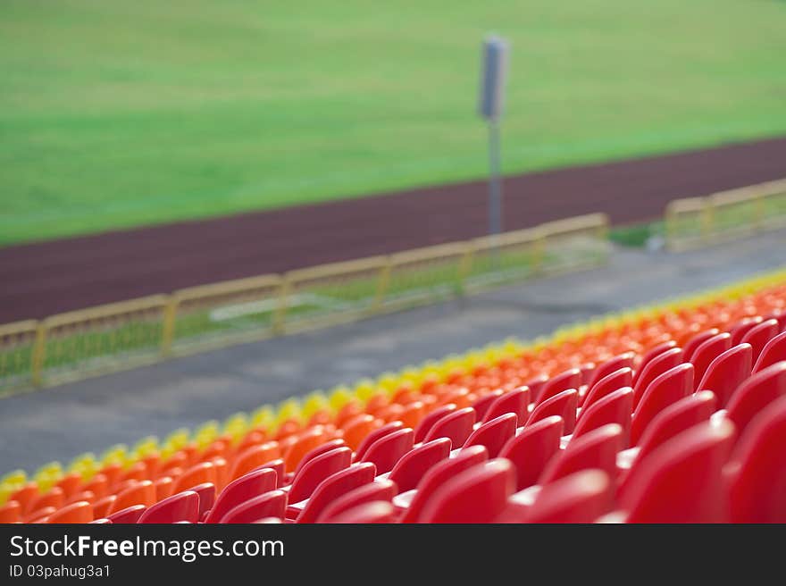 Empty plastic seats in a stadium