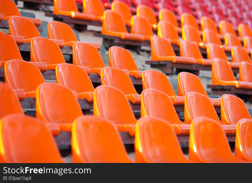 Emty tribunes with white sits and yellow steps on a soccer stadium. Emty tribunes with white sits and yellow steps on a soccer stadium