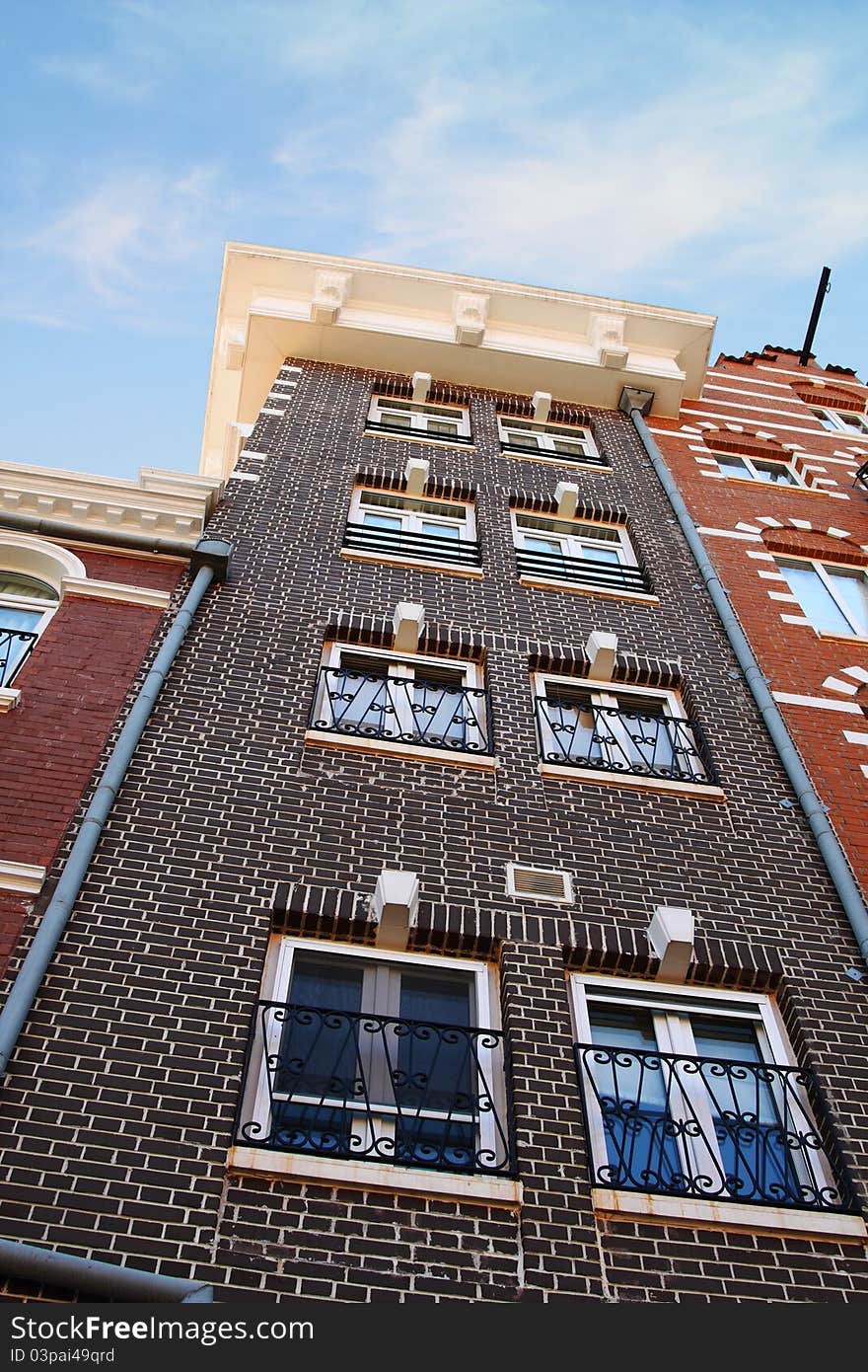 Brick building rising up to the sky