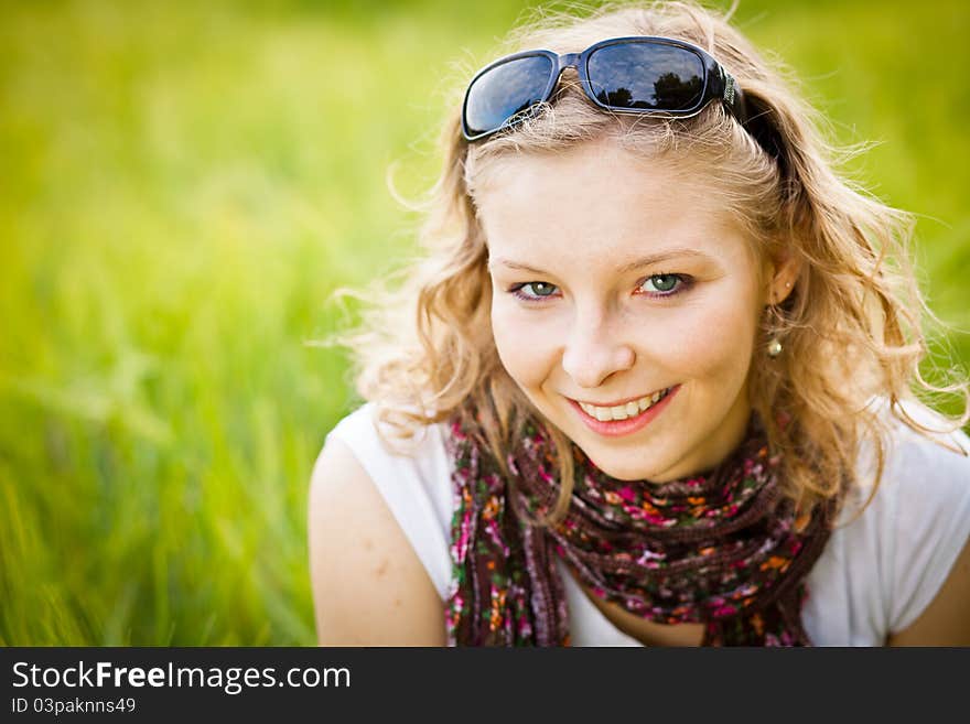 Young girl in wheat field in summer