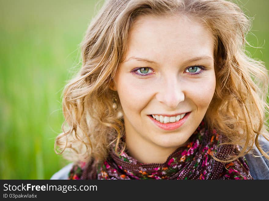 Young girl in wheat field in summer