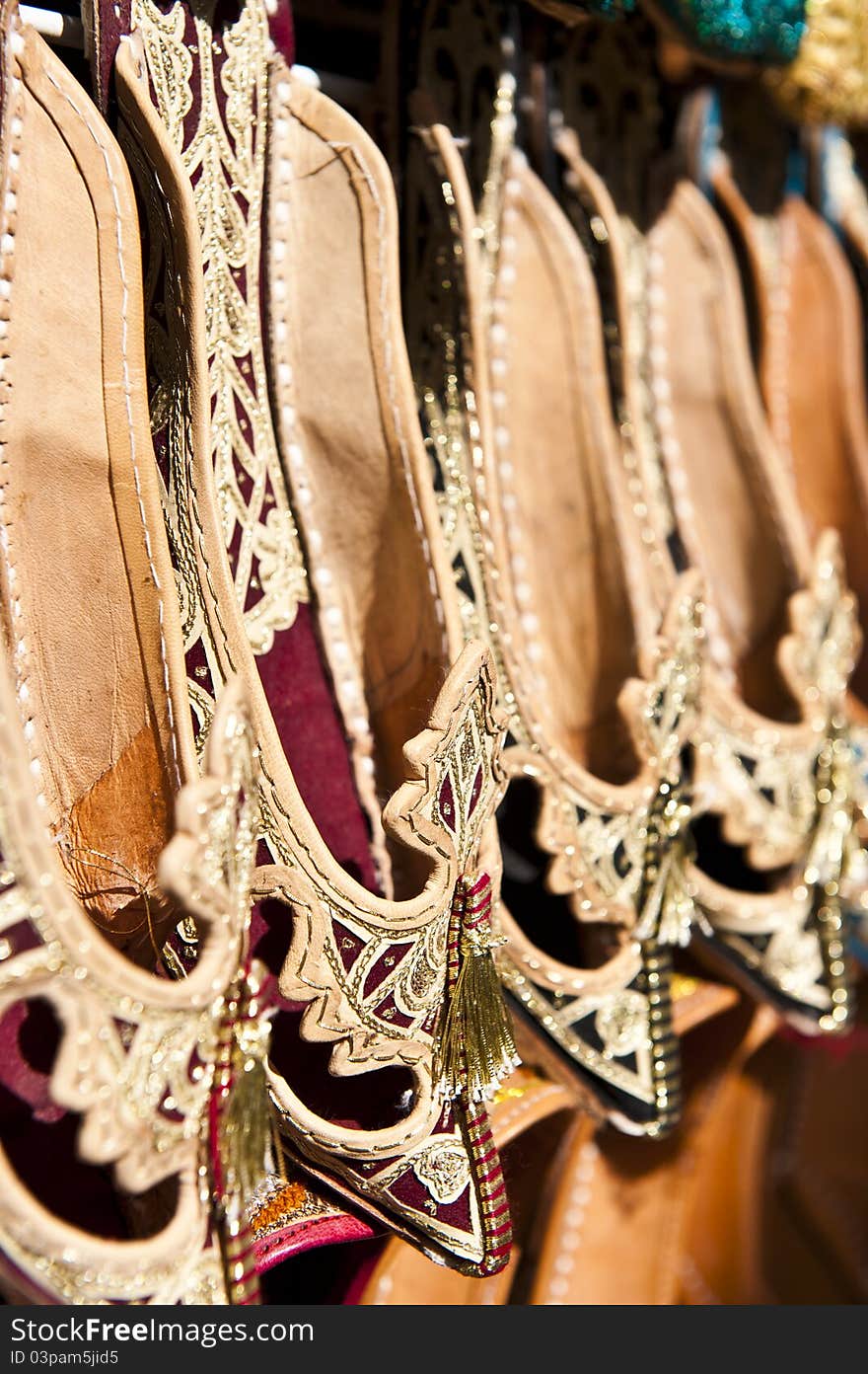 Rows of typically oriental shoes at the market in Dubai, shallow DOF.