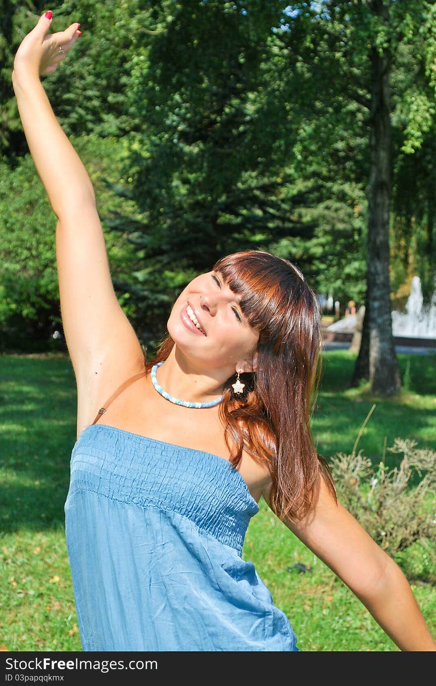 Beautiful young woman enjoying the nature. Beautiful young woman enjoying the nature