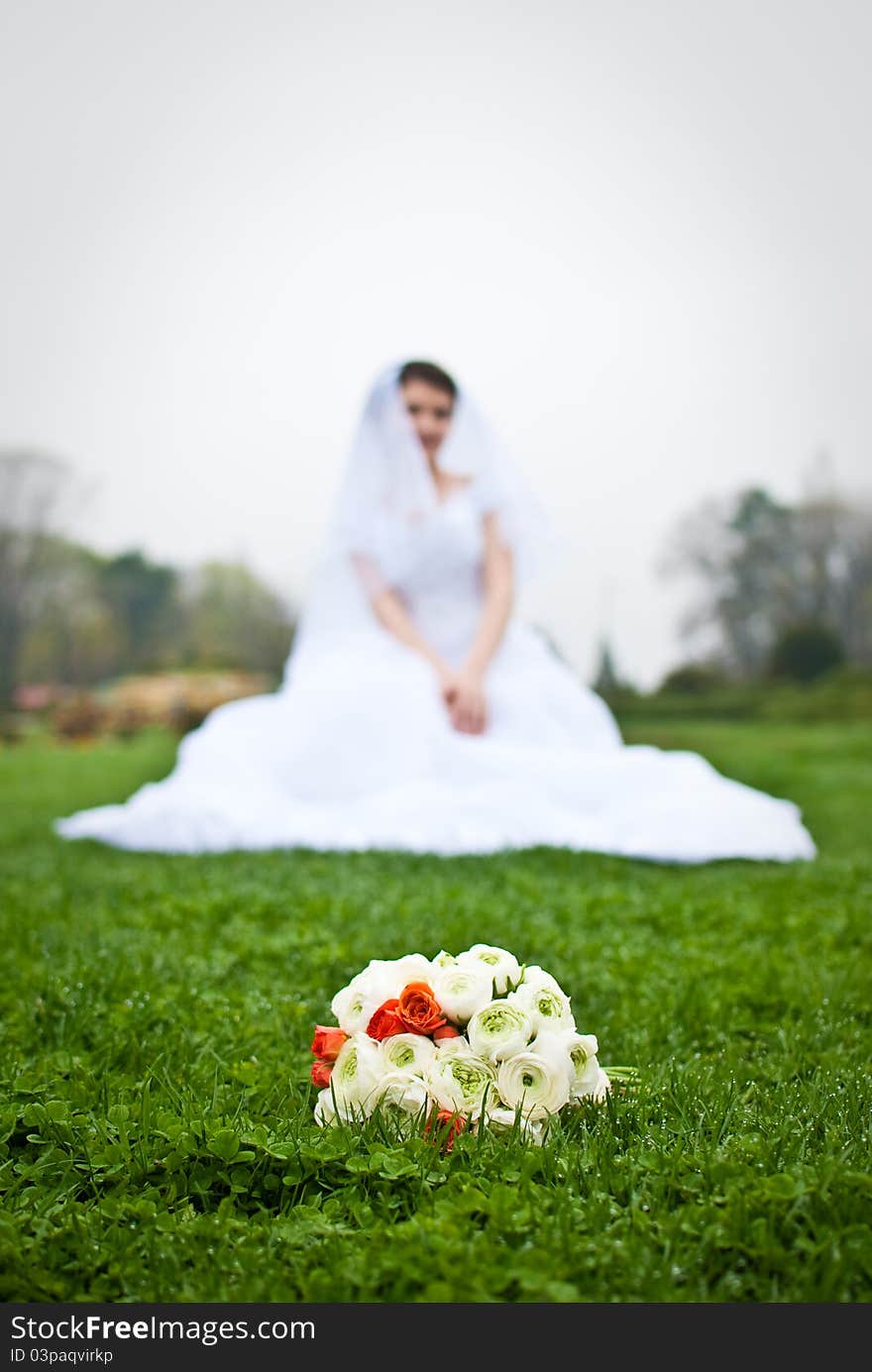 Isolated Bride's cluster bouquet on grass