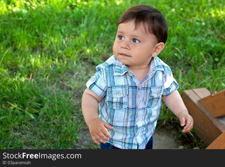 Beautiful little boy looking up