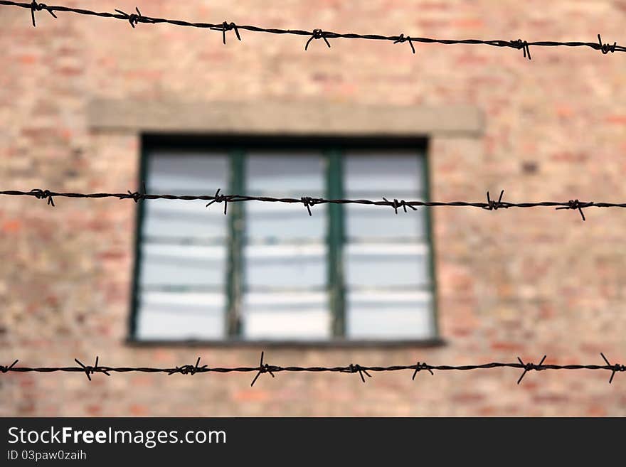 Building Behind Barbed Wire Fence