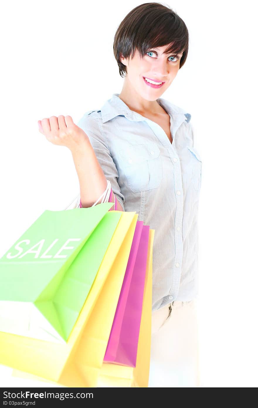 Beautiful girl holding colorful shopping bags