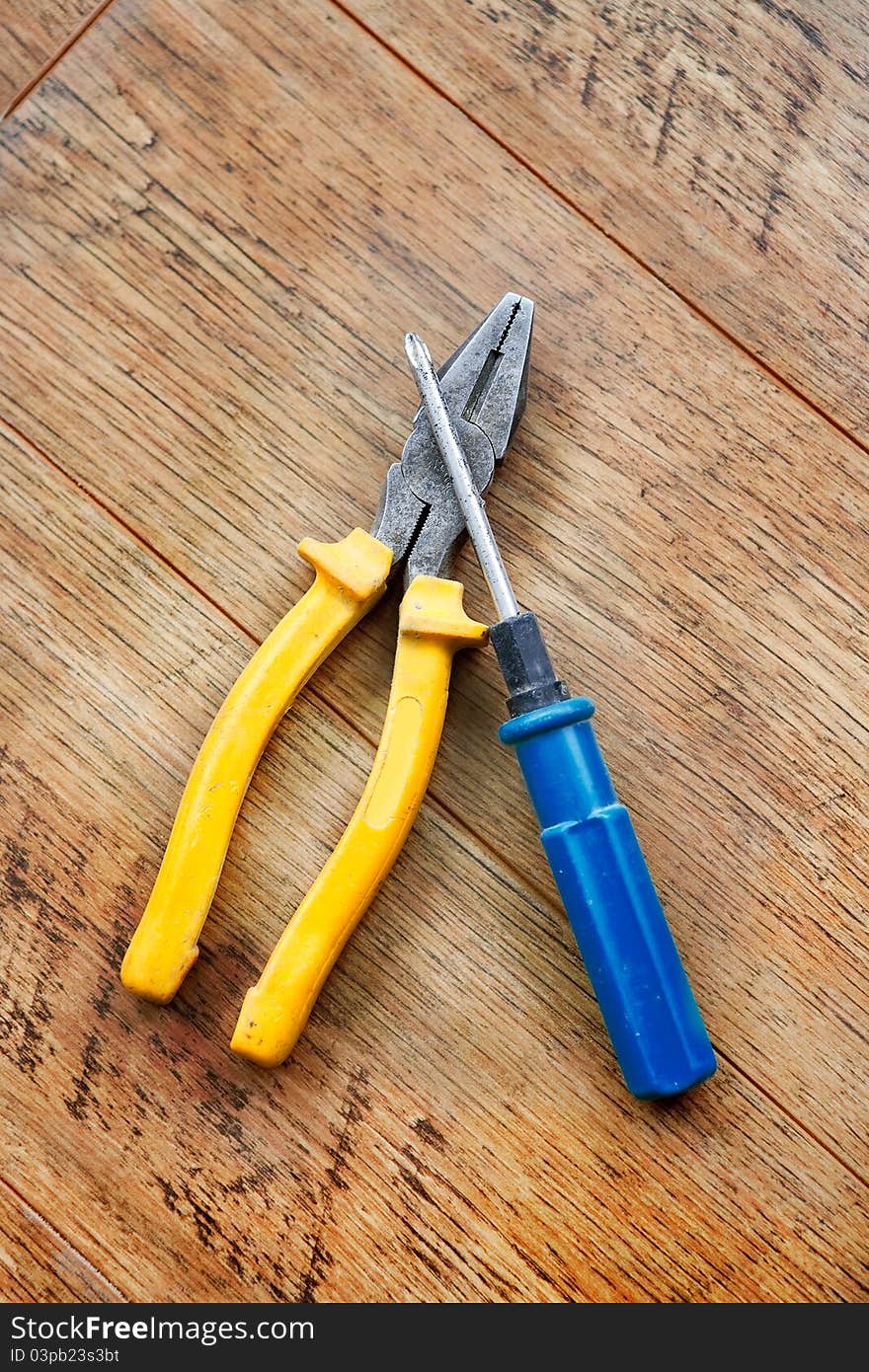 Hand tool on wood background