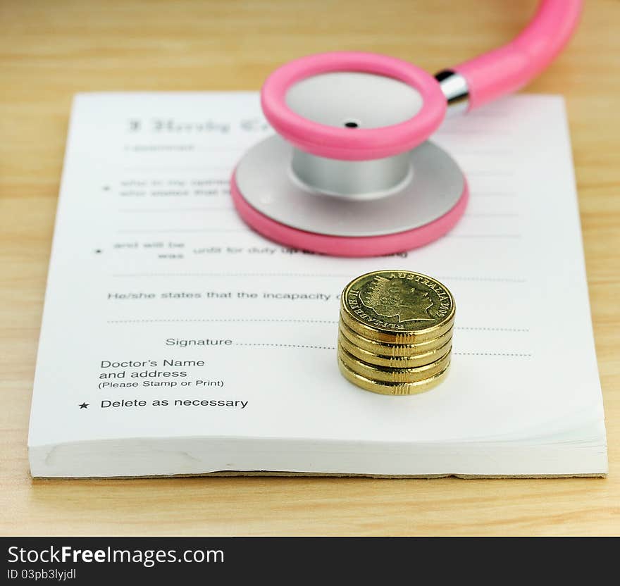 A doctor’s desk showing a pink colored stethoscope, stack of gold coins resting on a sick certificate pad, suggesting the price of keeping healthy is rising. A doctor’s desk showing a pink colored stethoscope, stack of gold coins resting on a sick certificate pad, suggesting the price of keeping healthy is rising.