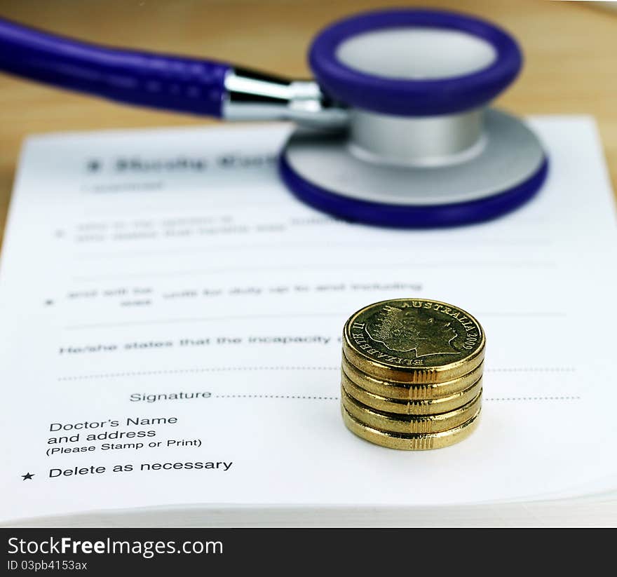 A doctor’s desk showing a purple colored stethoscope stack of gold coins all resting on a sick certificate pad, suggesting the price of keeping healthy is rising. A doctor’s desk showing a purple colored stethoscope stack of gold coins all resting on a sick certificate pad, suggesting the price of keeping healthy is rising.