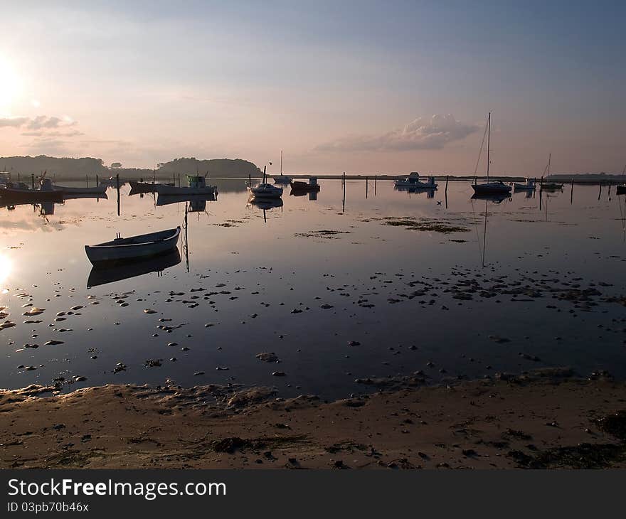 Reflection of a small dinghy dory boats