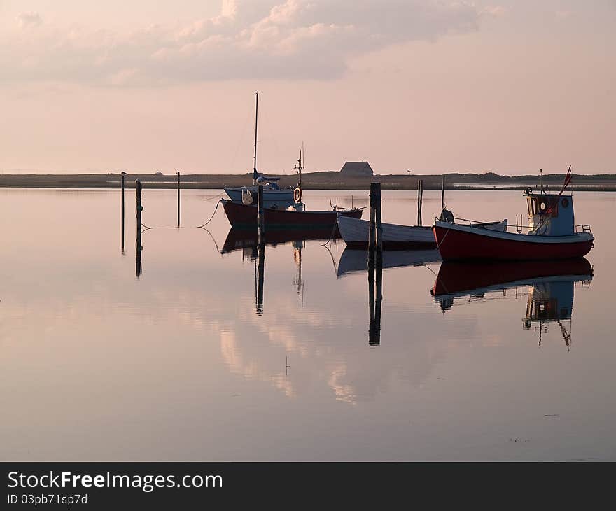 Reflection of a small dinghy dory boats