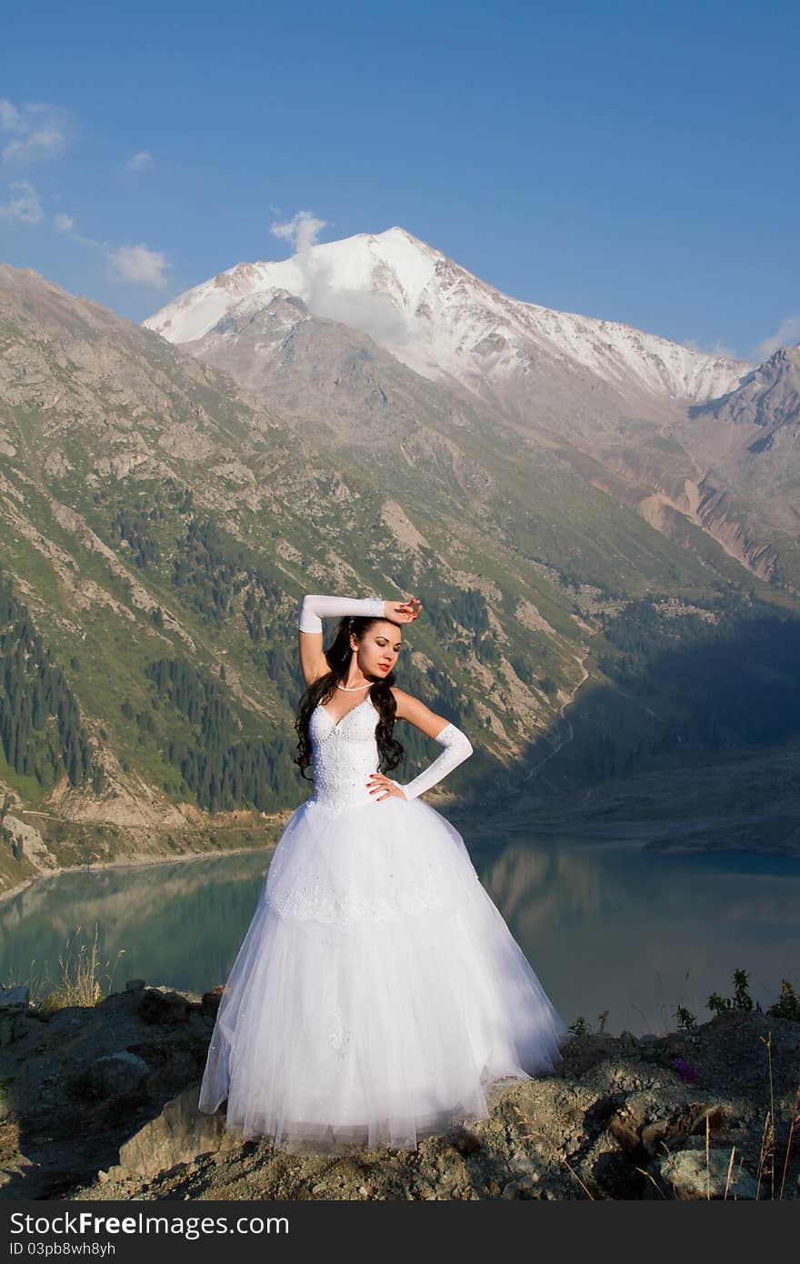 Girl in a wedding dress on the nature