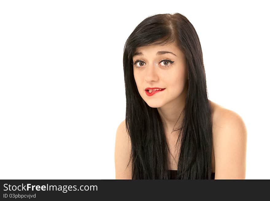 Beautiful brunette girl bit her lip on white background close-up