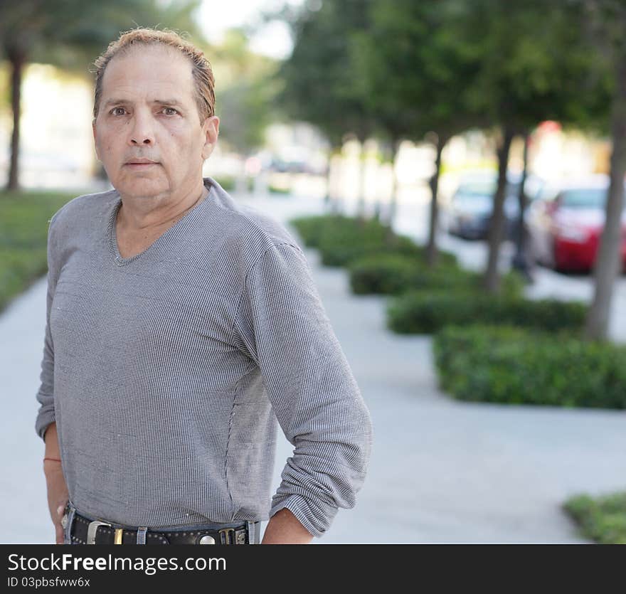 Image of a mature man posing in the city streets. Image of a mature man posing in the city streets