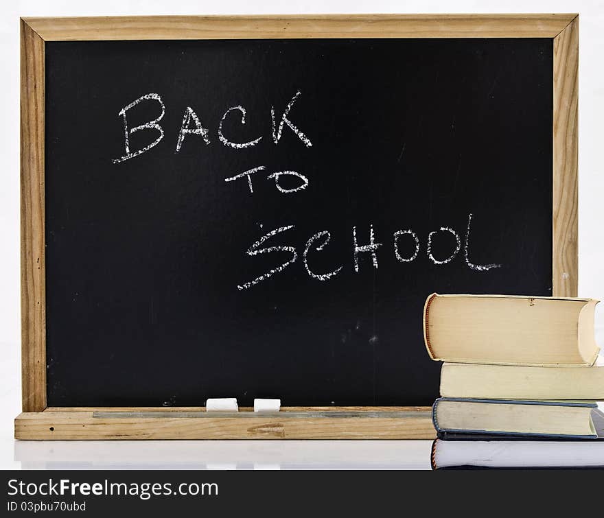 Back to school on blackboard inwhite background