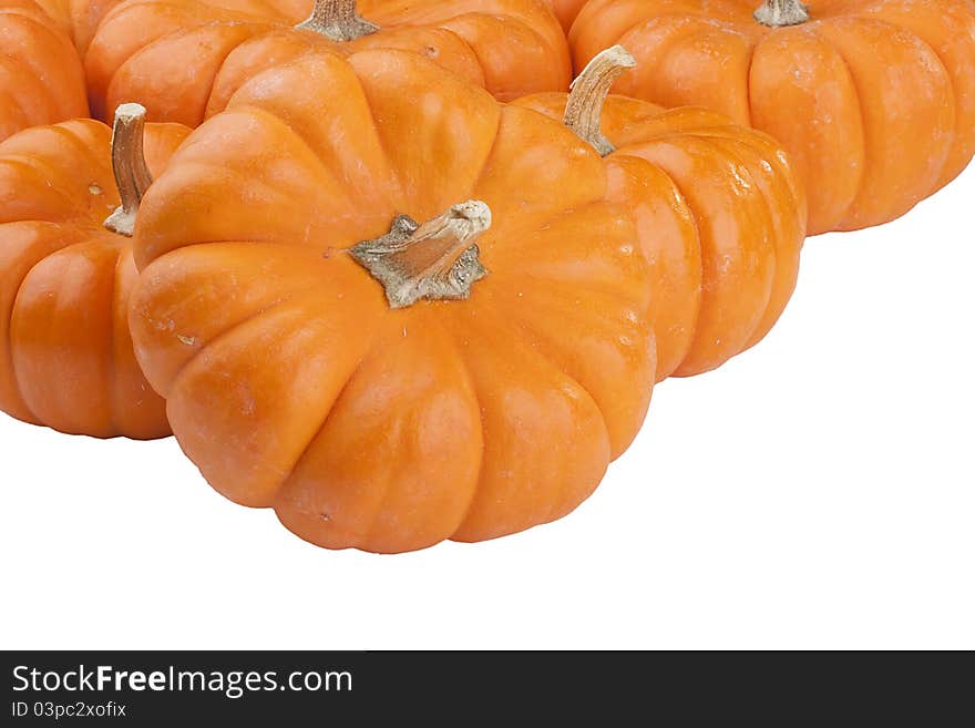 Small orange pumpkins symbolising autumn holidays and used in decorative works.