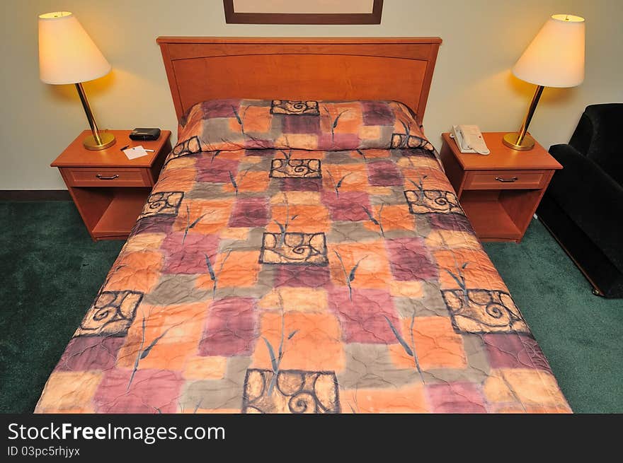 Large clean bed with lamps