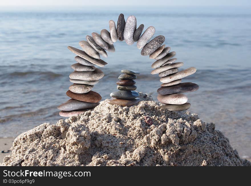 Stone bow on a sea background. Stone bow on a sea background