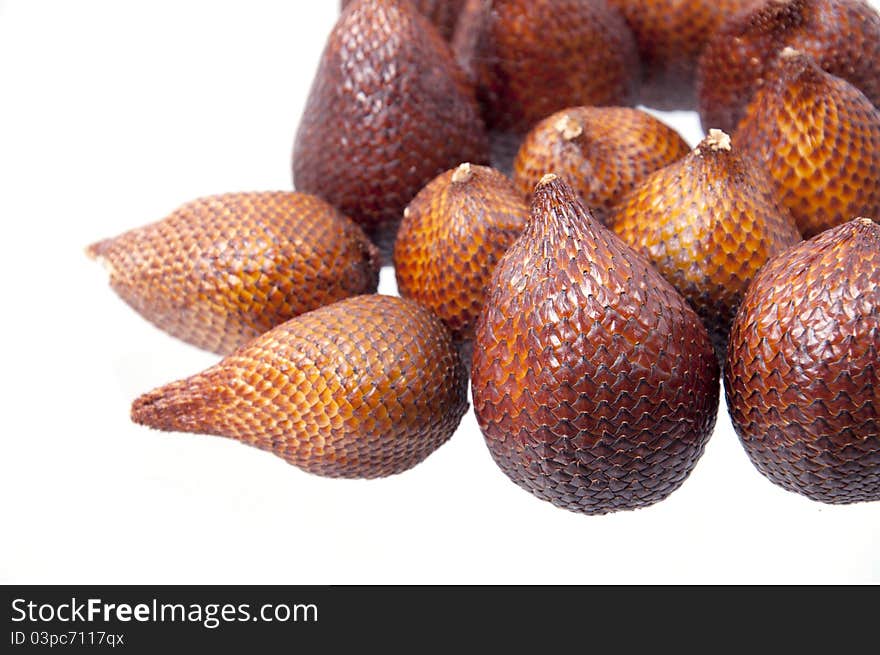 Isolated close-up zoom delicious exotic asian snake fruit food, as known as salak fruits. Isolated close-up zoom delicious exotic asian snake fruit food, as known as salak fruits.