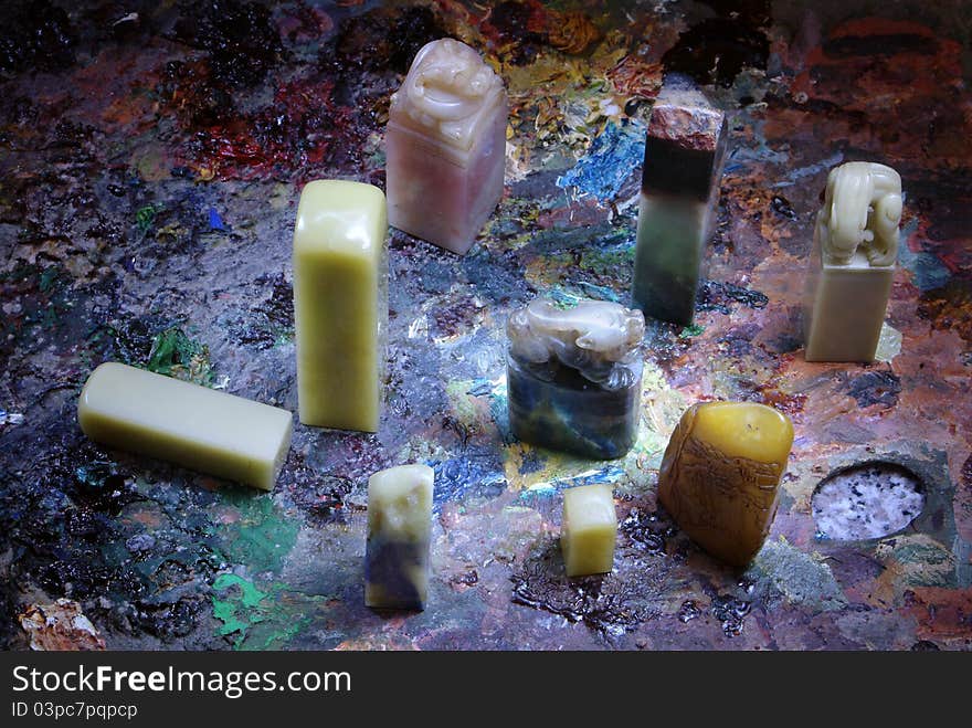 Traditional Chinese stone seals placed in a colorful background. Traditional Chinese stone seals placed in a colorful background