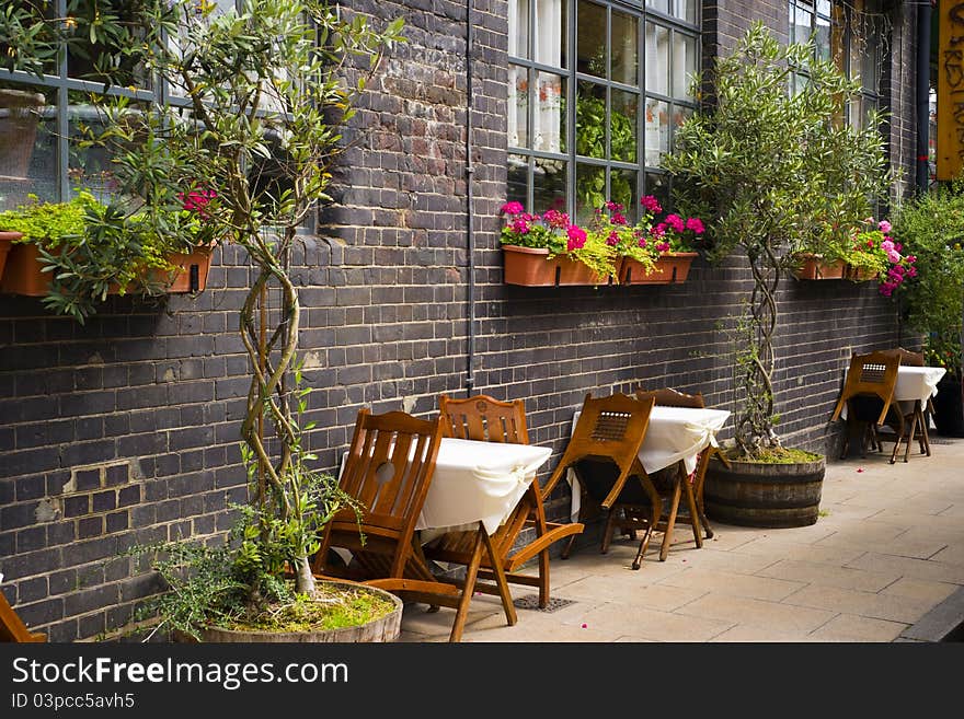 Tables standing along the brick Wall. Tables standing along the brick Wall