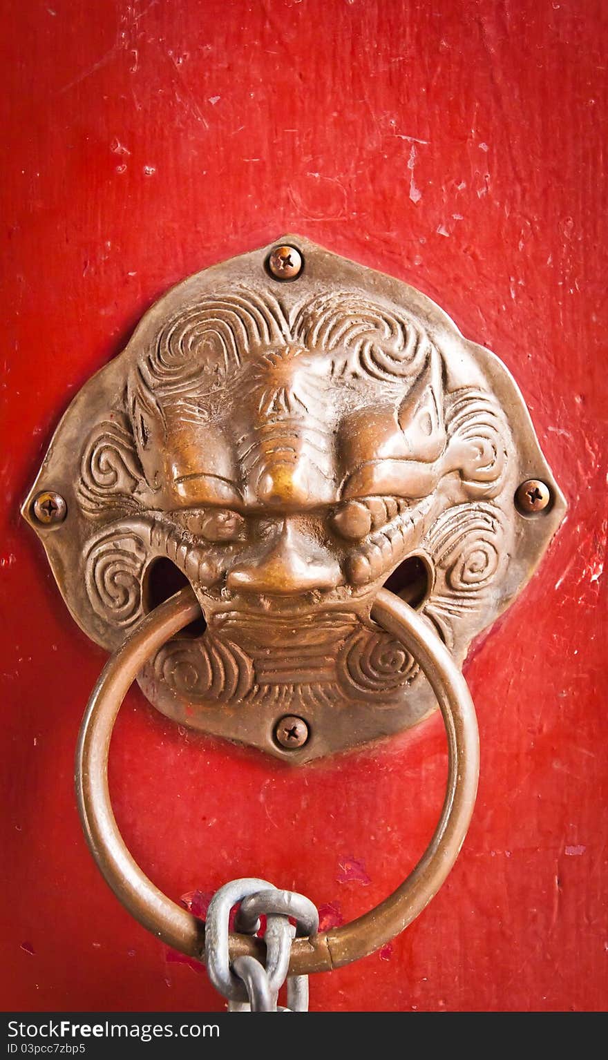 The red doors and door handles a lion