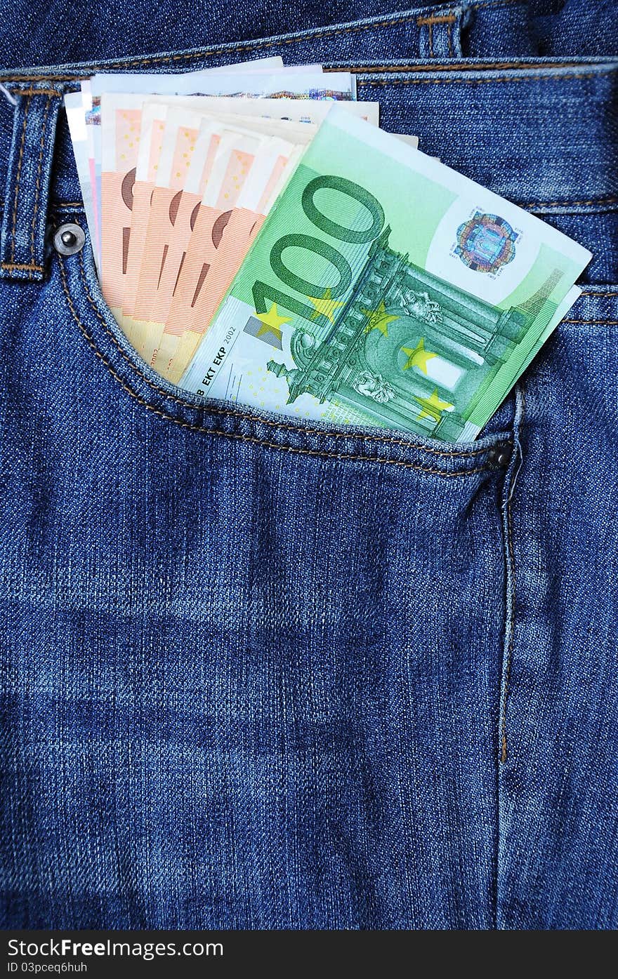 Euro banknotes in blue jeans pocket