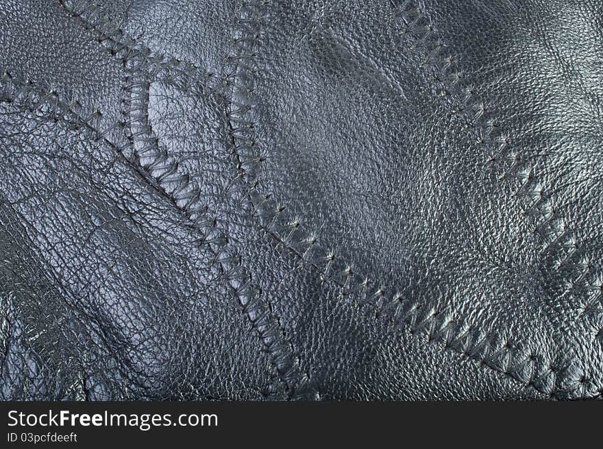 Black leather texture close-up. Black leather texture close-up.