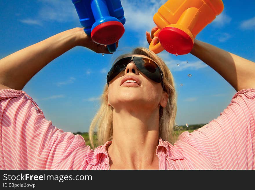 Woman watering herself