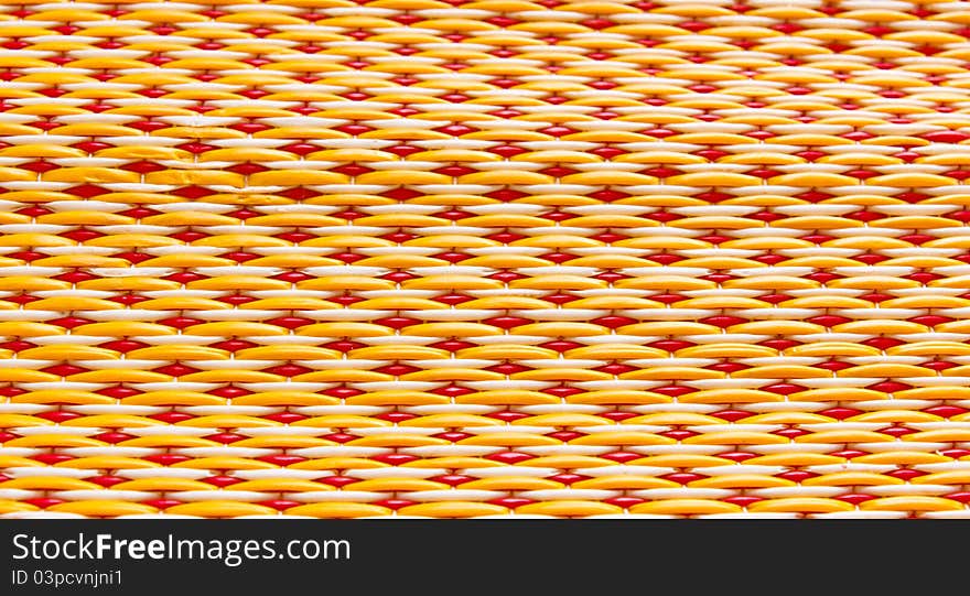 Thai woven mats yellow and red alternating back and forth