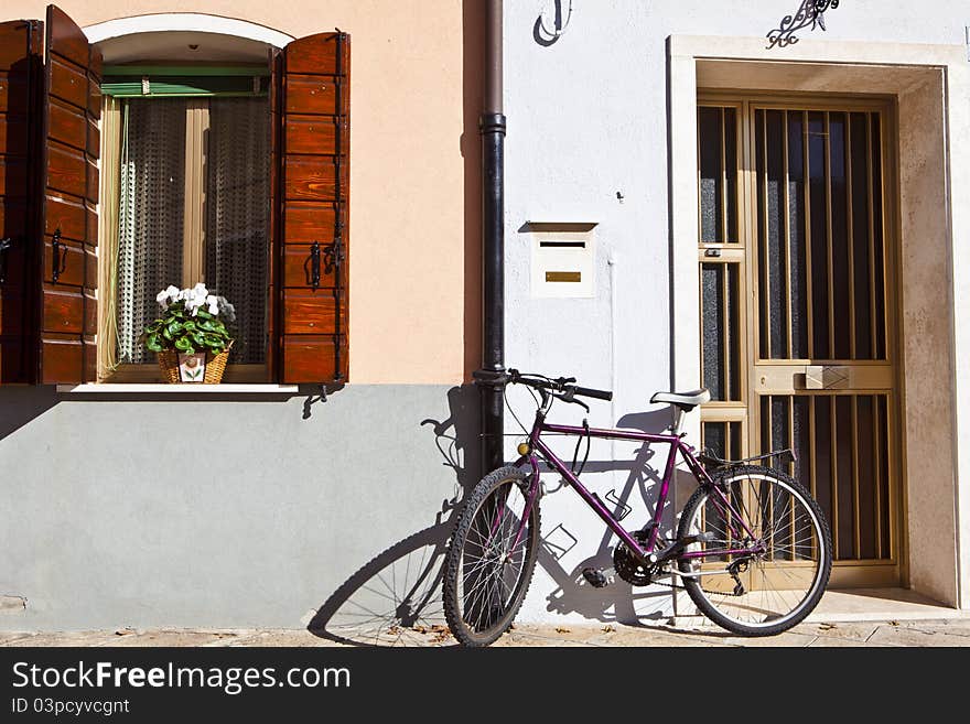 Bike leaning against a city wall. Bike leaning against a city wall.