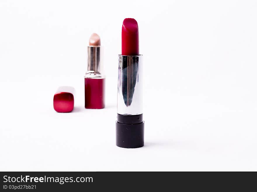 Red lipstick isolated on white background