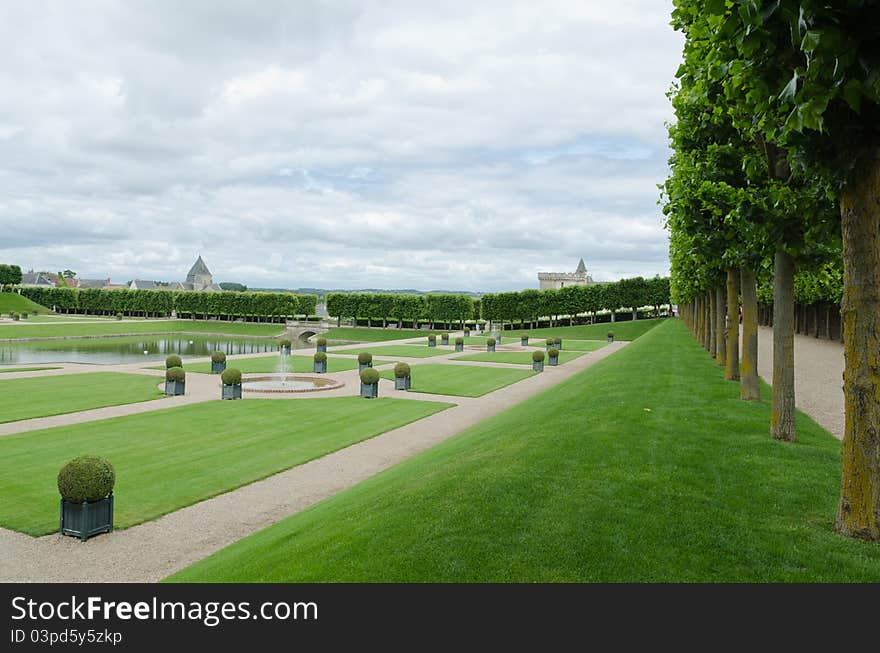 The garden of the Villandry castle, with the tower of the castle in the background. The garden of the Villandry castle, with the tower of the castle in the background