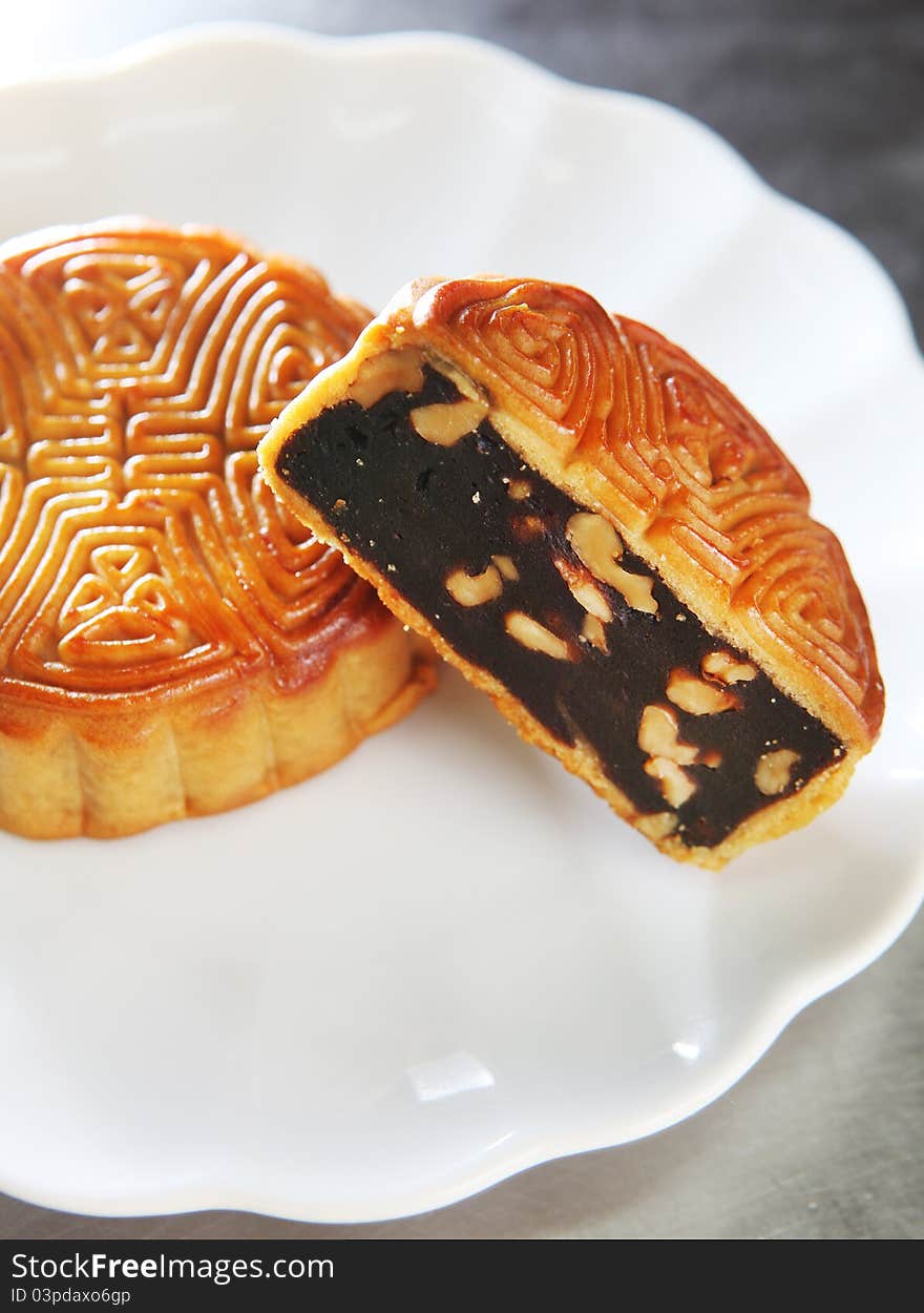 Chinese cake, moon cake with nuts inside.