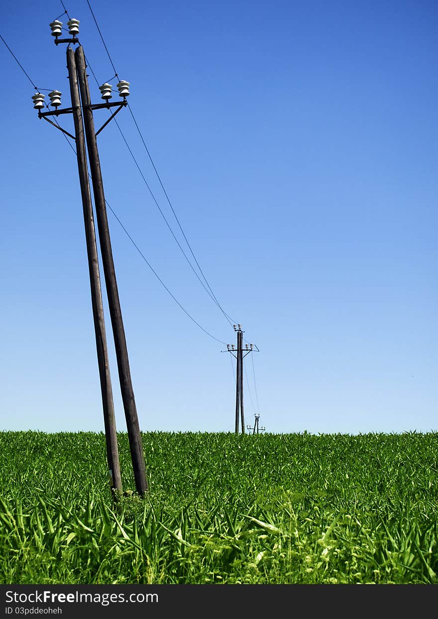 Old power lines and clear blue sky