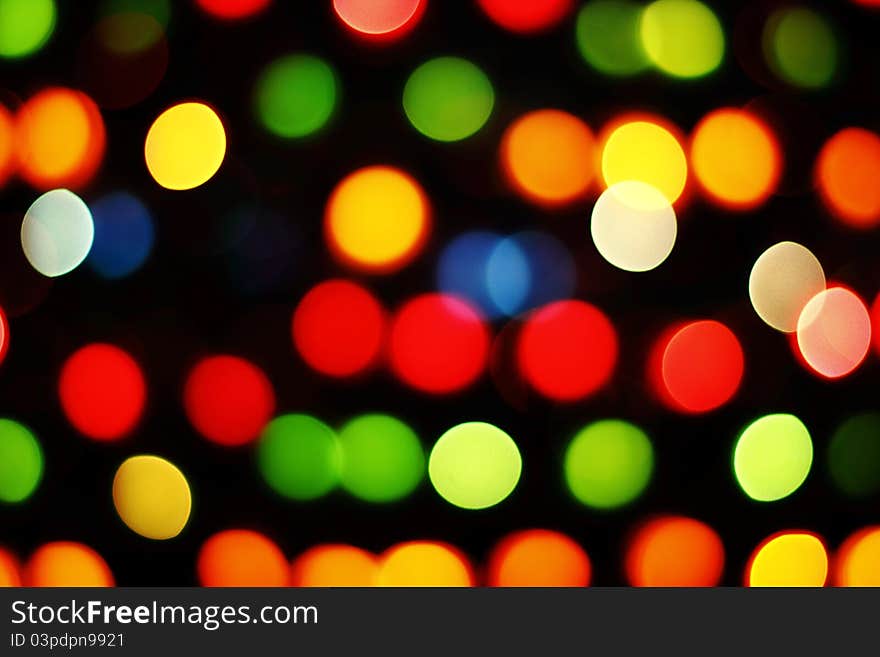 Blurred colored light on a black background. Blurred colored light on a black background