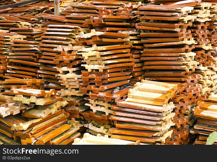 Close up of a stack of ceramic roof tiles. Close up of a stack of ceramic roof tiles.