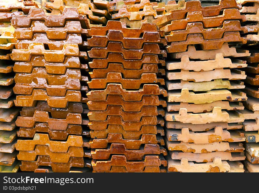 Close up of a stack of ceramic roof tiles. Close up of a stack of ceramic roof tiles.