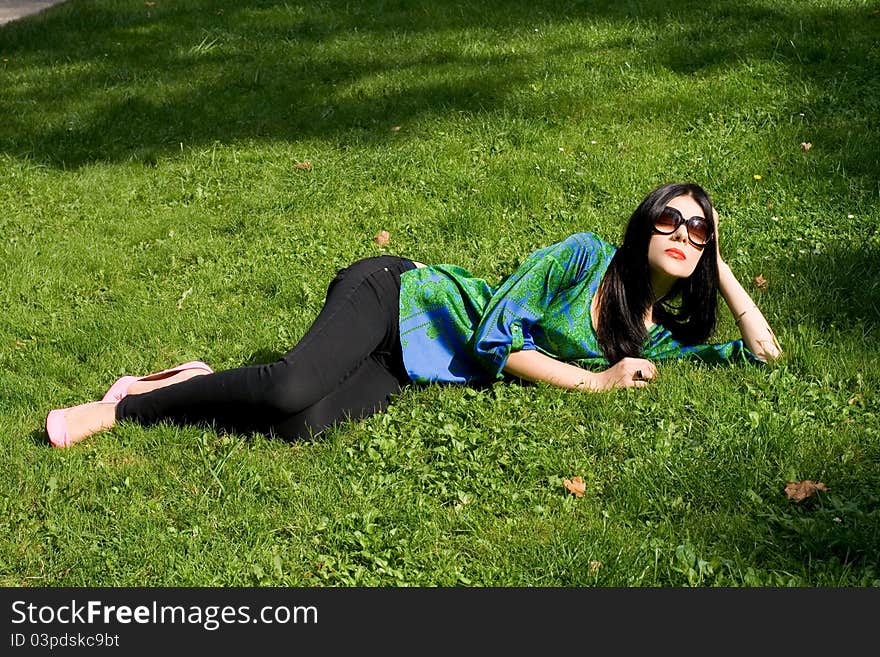 Girl lying on grass in park