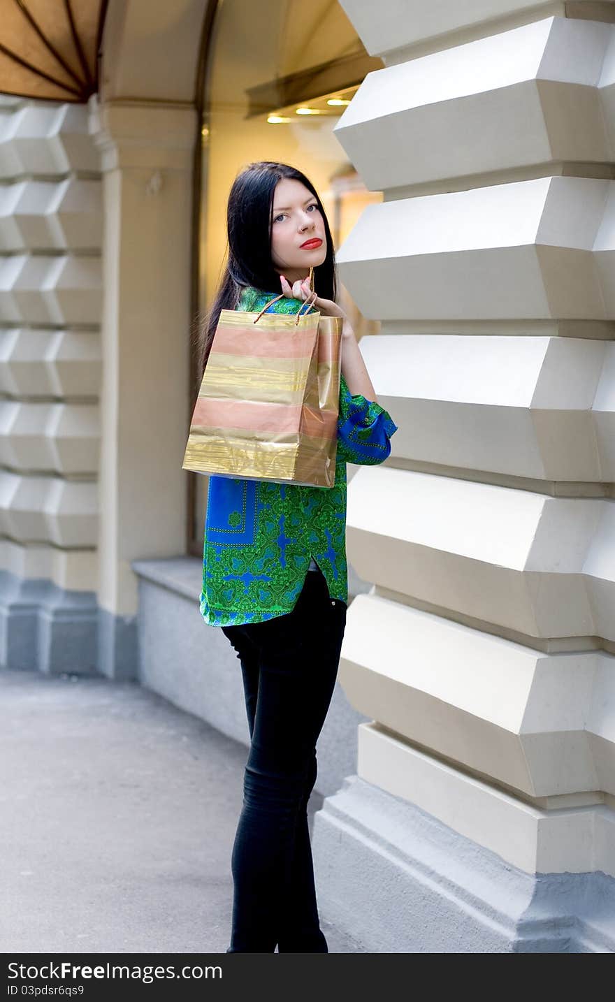 Shopping girl walking outdoor in city