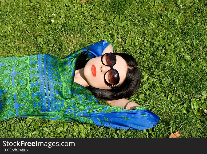 Girl lying on grass in park