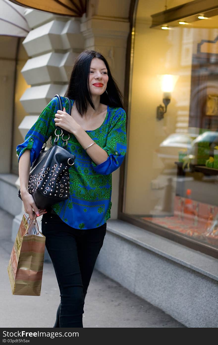 Shopping girl walking outdoor in city